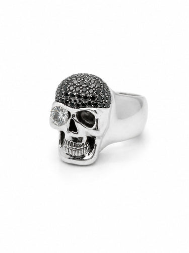 64 Bague tête de mort en or gris et diamants 58 Facettes 40