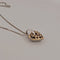 Collier cœur en or jaune et blanc avec brillants 58 Facettes 2909737