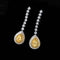 Boucles d'oreilles poire en or blanc 18K et diamants jaunes 58 Facettes GER1344WG