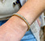 Bracelet jonc ouvrant en or jaune 18 carats et diamants 58 Facettes 90939