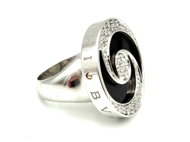 52 Bvlgari Optical - Bague en or blanc, acier, onyx et diamants 58 Facettes BVLGARI BG