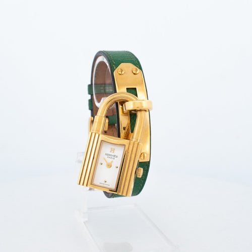 Hermès Kelly - Montre en acier plaqué or, cadran ivoire 58 Facettes 563