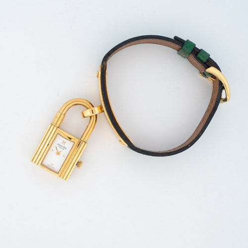 Hermès Kelly - Montre en acier plaqué or, cadran ivoire 58 Facettes 563