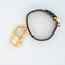 Hermès Kelly - Montre en acier plaqué or, cadran ivoire 58 Facettes 563