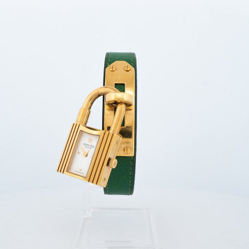 Hermès Kelly - Montre en acier plaqué or, cadran ivoire 58 Facettes 563