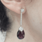Boucles d'oreilles en or blanc, diamants et grenats rhodolites 58 Facettes PE275