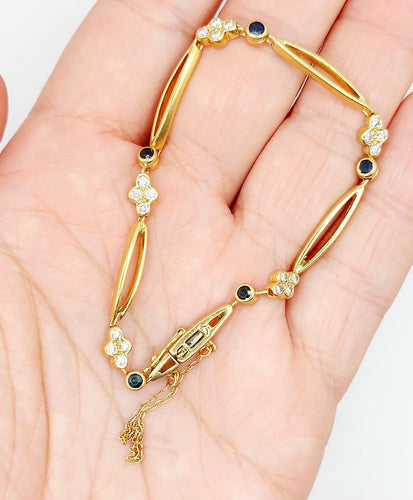 Bracelet vintage en or 18k, diamants et saphirs 58 Facettes A07641