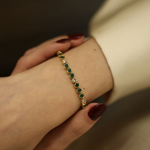 bracelet-emeraudes-3-cts-et-diamants-110-ct-h-vs-en-or-jaune-18k-18-cm.jpg
