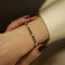 bracelet-emeraudes-3-cts-et-diamants-110-ct-h-vs-en-or-jaune-18k-18-cm.jpg