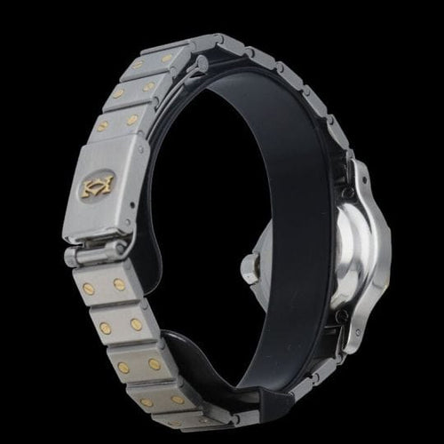 Cartier Santos - Montre ronde octogonale en or jaune et acier 58 Facettes MT47838