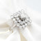 57 Bague en or blanc avec diamant central et diamants double entourage 58 Facettes 18003