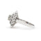 57 Bague en or blanc avec diamant central et diamants double entourage 58 Facettes 18003