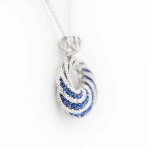 Collier pendentif spirale en or blanc, diamants et saphirs 58 Facettes 21541