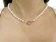 Dinh Van Menottes R12 - Collier en or blanc 18k et perles Akoya 58 Facettes 276175