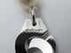 Dinh Van Menottes R12 - Collier en or blanc 18k et perles Akoya 58 Facettes 276175