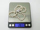Dinh Van Menottes R12 - Collier en or blanc 18k et perles Akoya 58 Facettes 276175