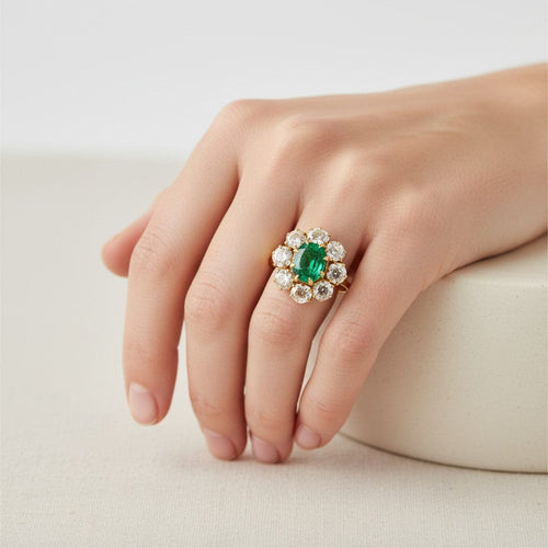 https://cdn.shopify.com/s/files/1/1015/8633/8124/files/vintage-18k-gold-pompadour-zambian-emerald-diamond-ring-worn.jpg?v=1785510298
