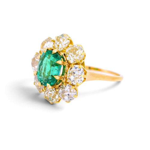 https://cdn.shopify.com/s/files/1/1015/8633/8124/files/vintage-18k-gold-pompadour-zambian-emerald-diamond-ring-left.jpg?v=1785510356