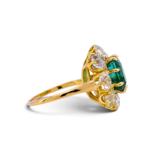 https://cdn.shopify.com/s/files/1/1015/8633/8124/files/vintage-18k-gold-pompadour-zambian-emerald-diamond-ring-emerald-detail.jpg?v=1785510386