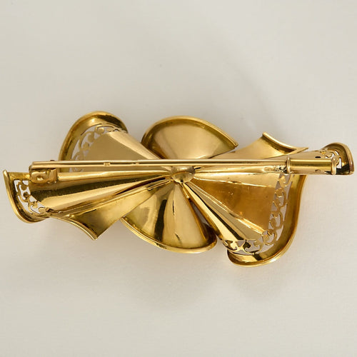 Broche Nœud en or jaune, or gris et diamants 58 Facettes EB7