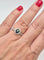 51 Solitaire Halo - Bague en or gris avec saphir teal et diamants 58 Facettes 324.201