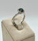 51 Solitaire Halo - Bague en or gris avec saphir teal et diamants 58 Facettes 324.201