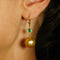 Boucles d'oreilles en or jaune, émeraudes, diamants et perles des Mers du Sud 58 Facettes E0038