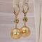 Boucles d'oreilles en or jaune, émeraudes, diamants et perles des Mers du Sud 58 Facettes E0038