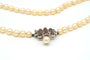 Collier années 70 en or blanc, perles et rubis 58 Facettes B278