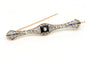 Broche Art Déco en or jaune et blanc, onyx, saphirs et diamants 58 Facettes 23114