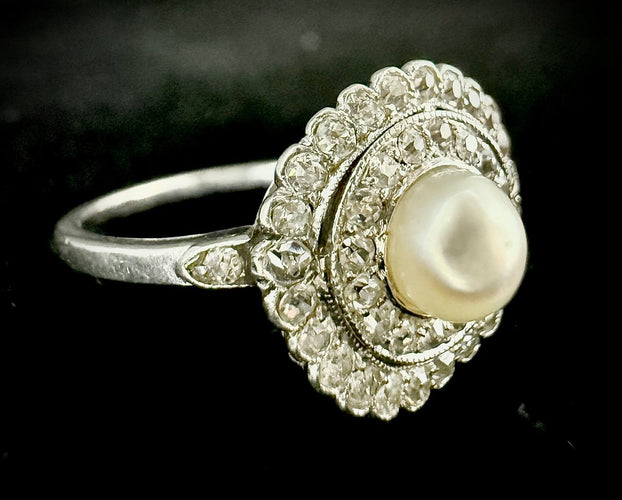 55 Art nouveau - Bague en platine, perle fine et diamants 58 Facettes Bague 23