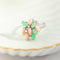 61 Bague fleur en or blanc 585, corail, chrysoprase et diamants 58 Facettes HJ062634