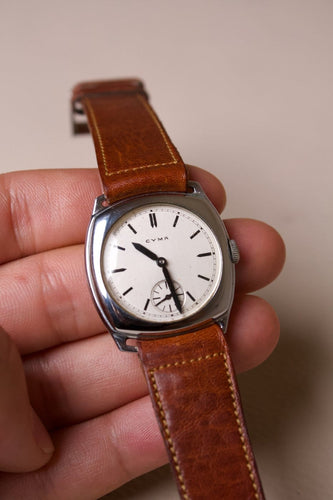 Cyma - Montre coussin en acier, cadran blanc, années 1940 58 Facettes MONTRE-019
