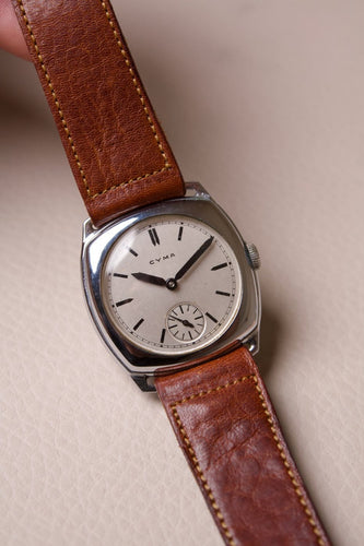 Cyma - Montre coussin en acier, cadran blanc, années 1940 58 Facettes MONTRE-019
