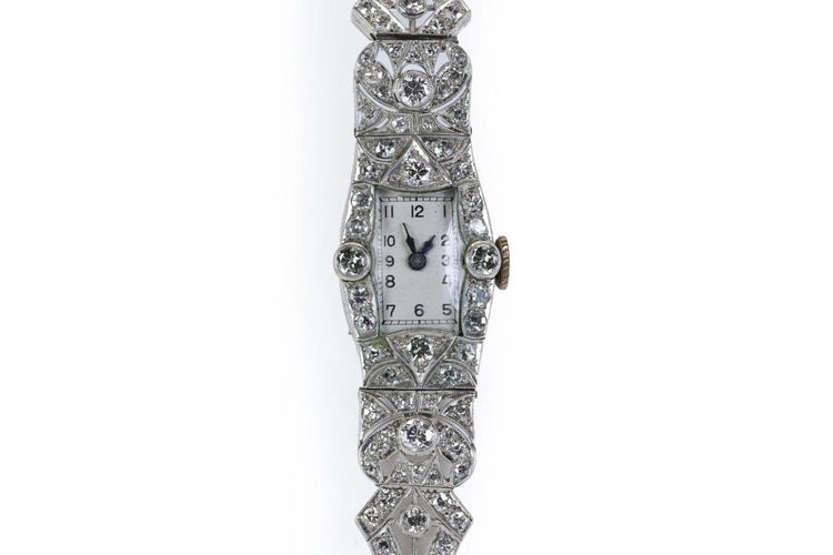 Montre Art déco en platine et diamants 58 Facettes 10039