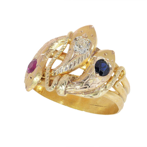 61 Bague triple serpent en or jaune, rubis, saphir et diamant 58 Facettes 26106-0234