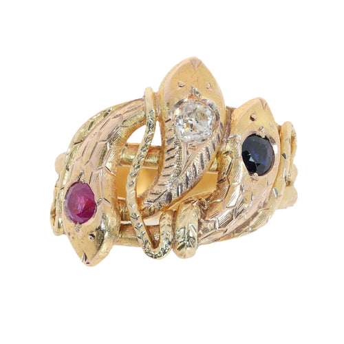 61 Bague triple serpent en or jaune, rubis, saphir et diamant 58 Facettes 26106-0234