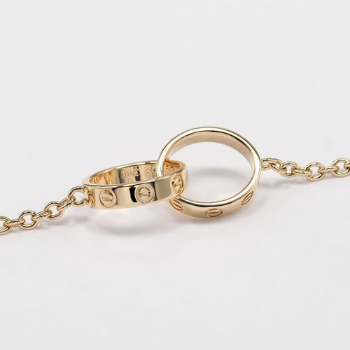 Cartier Love Interlocking - Bracelet en or jaune 18K 58 Facettes atme25rdd0