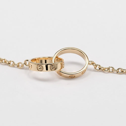 Cartier Love Interlocking - Bracelet en or jaune 18K 58 Facettes atme25rdd0