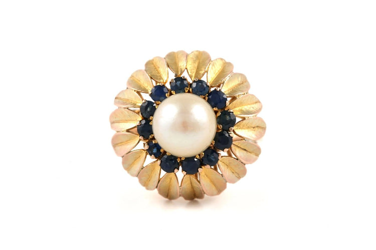 56 Bague années 50 en or jaune, perle et saphirs 58 Facettes 23900