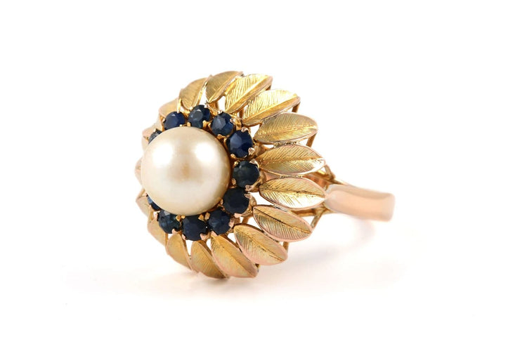 56 Bague années 50 en or jaune, perle et saphirs 58 Facettes 23900