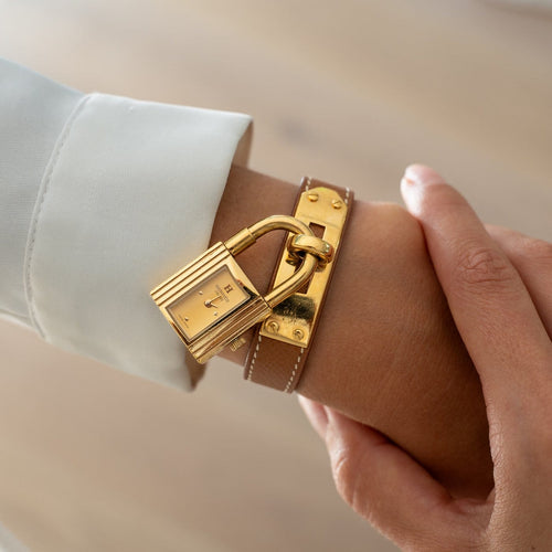 Hermès Kelly - Montre acier plaqué or cadran champagne 58 Facettes 576