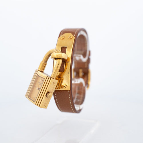 Hermès Kelly - Montre acier plaqué or cadran champagne 58 Facettes 576
