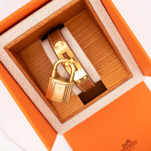 Hermès Kelly - Montre acier plaqué or cadran champagne 58 Facettes 576