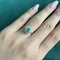 55 Bague halo en or blanc avec émeraude et diamants 58 Facettes 42673