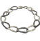 Bracelet années 80 en or blanc, diamants et saphirs 58 Facettes 4525AA