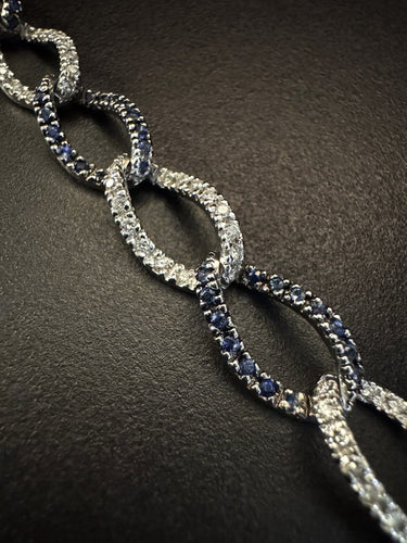 Bracelet années 80 en or blanc, diamants et saphirs 58 Facettes 4525AA