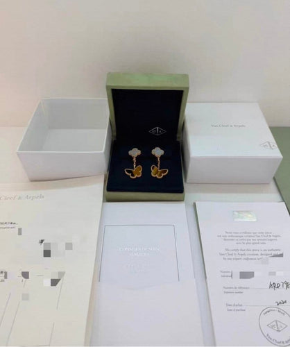 Van Cleef & Arpels - Boucles d’oreilles en or jaune, nacre et œil de tigre 58 Facettes jnci169