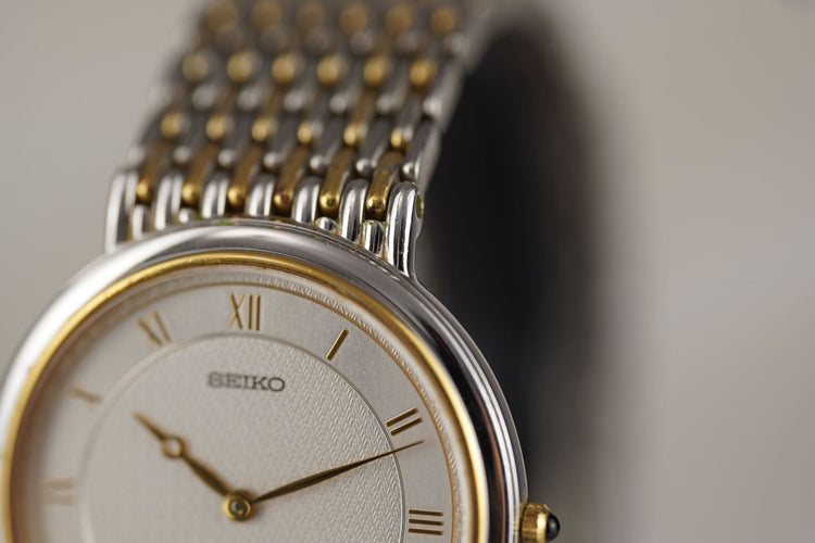 Seiko Dolce - Montre homme en acier bicolore 58 Facettes TOT-11016