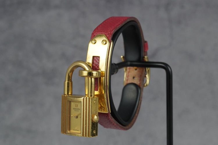 Hermès Kelly - Montre plaqué or bracelet cuir rouge 58 Facettes TOT-11286